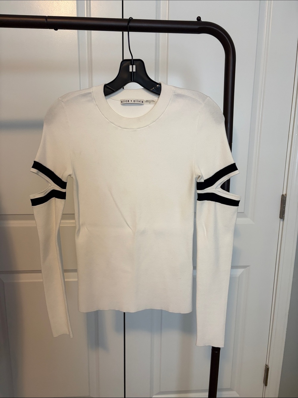 Alice + Olivia White Knit Top with Black Sleeve Stripes and cut outs